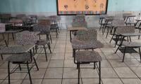 Tapas de botellas se convierte en pupitres